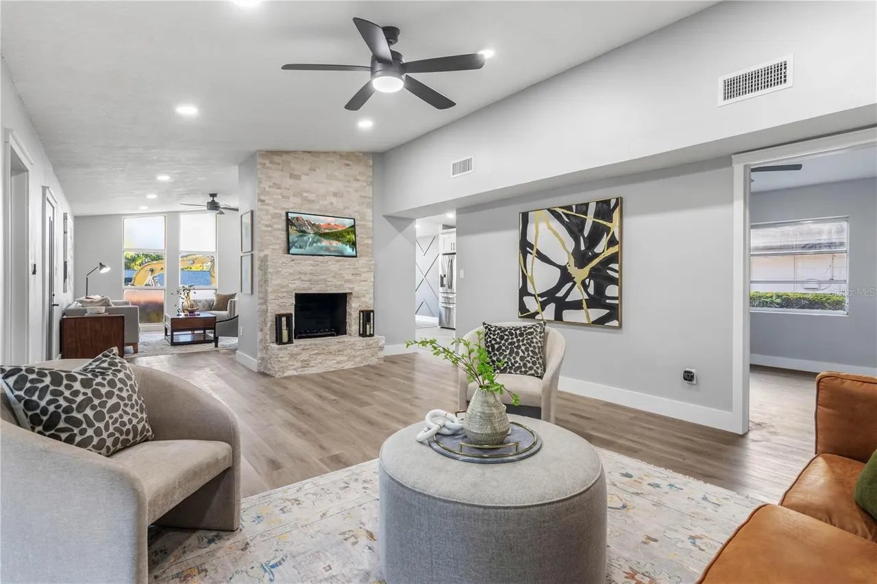 Finished living room with fireplace by McFarlane Construction Group